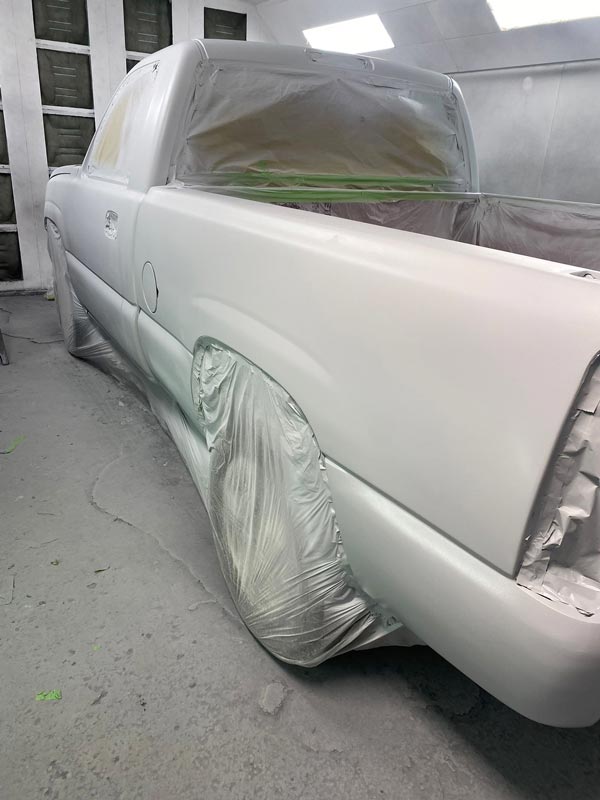 Professional masking protecting trim and glass during paint process