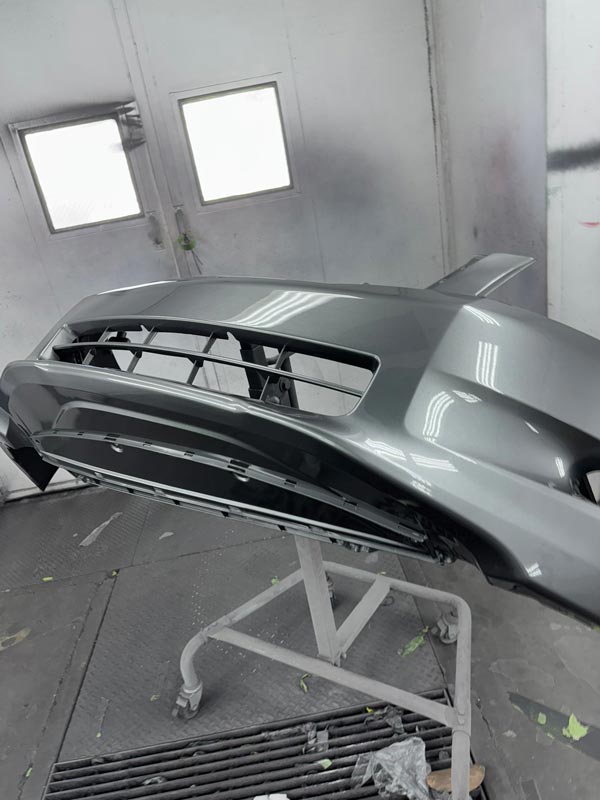 Front bumper with grille opening - final finish