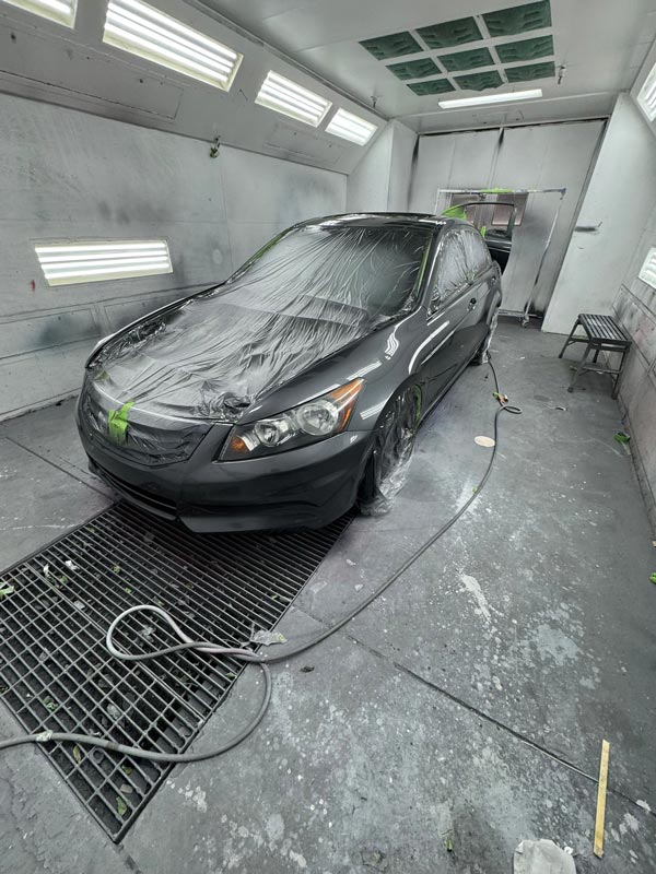 Professional spray booth setup with controlled environment