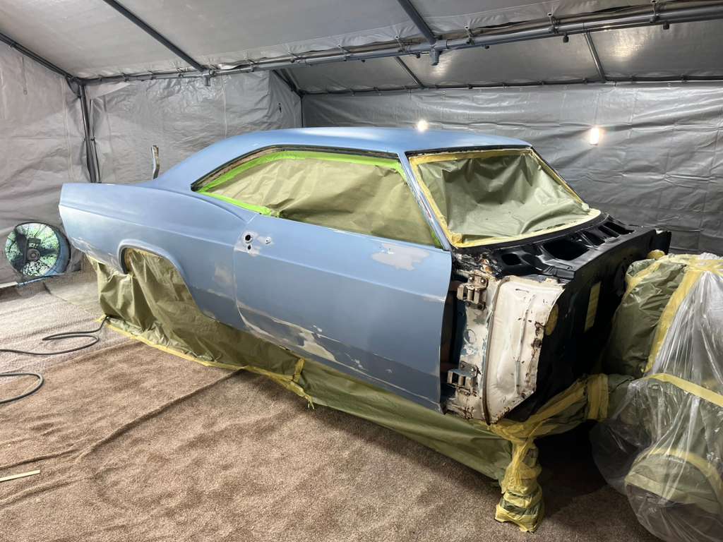Body in paint booth - primer coat application