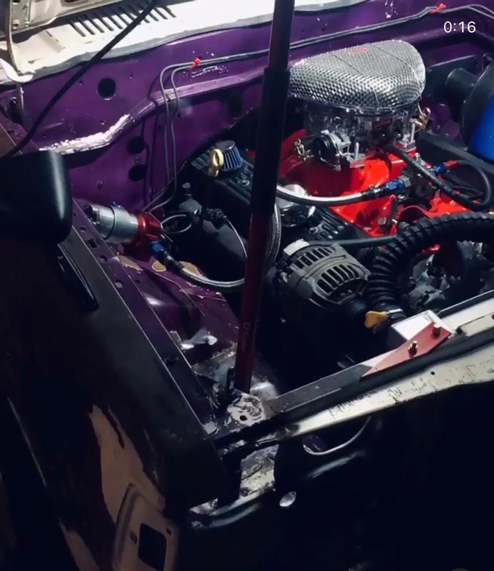 5.7L V8 engine bay with red block and custom installation work
