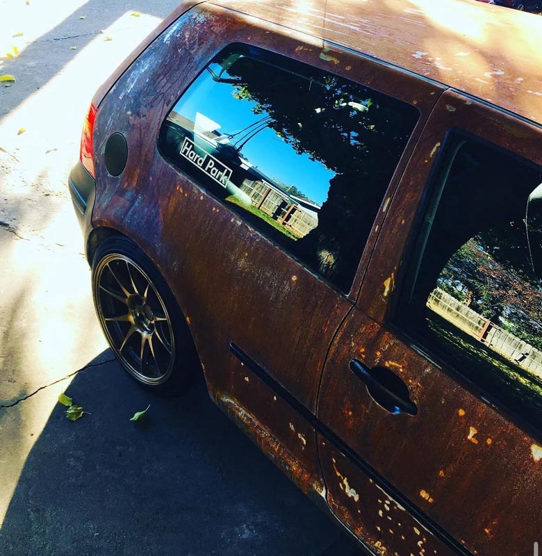 VW Golf with custom natural rust patina finish - rear quarter panel detail