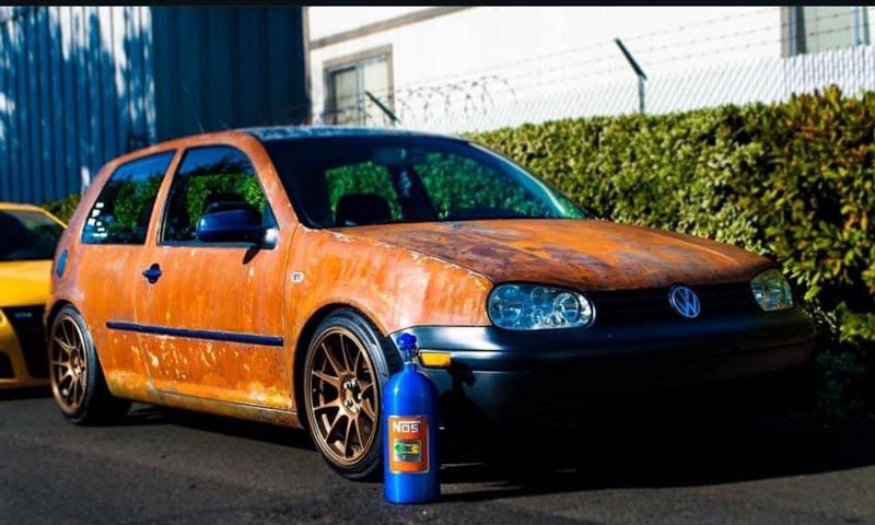 Front three-quarter view with NOS bottle and custom modifications