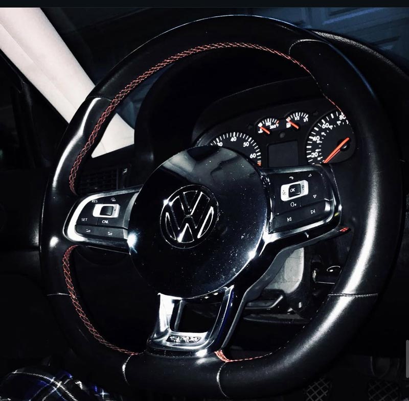 Interior view showing VW steering wheel and custom interior details