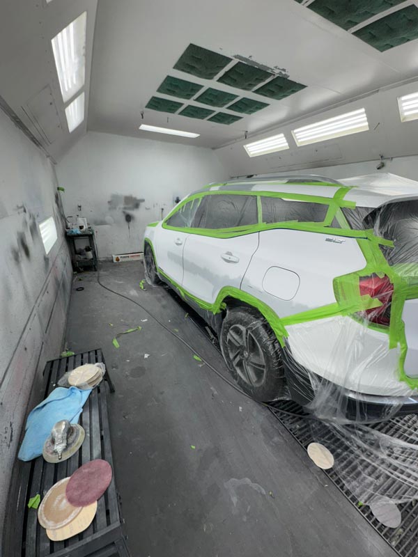 Side profile showing professional paint booth environment