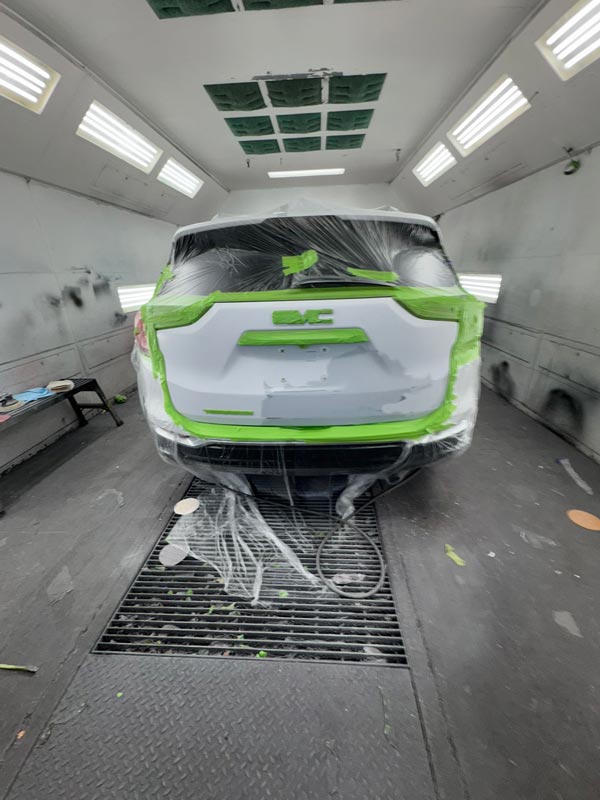 Rear view with tailgate masking and paint preparation